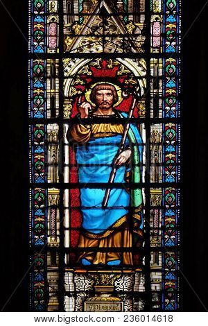 PARIS, FRANCE - JANUARY 05: Saint Dionysius, stained glass window in the Basilica of Saint Clotilde in Paris, France on January 05, 2018.