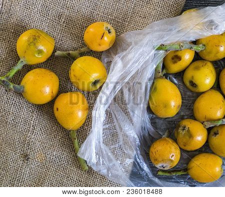 Mature Japanese Medlar, Spring Fruity, Japanese Medlar Japanese Medlar On Wooden Floor