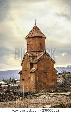 Church St. Sarkis Of The Red Tuff,against A Background Of A Cloudy Sky, Located On A Hill Near The K