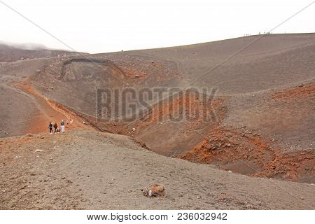 The Etna Volcano. The Etna Volcano Crater. Black Volcanic Earth, Volcanic Lava And Stones.  Dense Fo