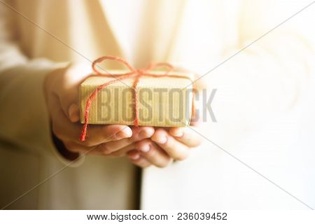 Hand Holding Red Gift Box, With Copy Space