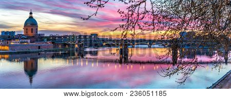 Panorama Of The Sunset Over The Garonne River With Hopital La Grave And Saint Pierre Bridge Visible