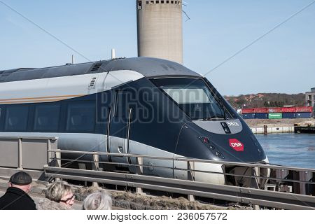 Vordingborg Denmark - April 6. 2018: A Dsb Ic4 Train Passing The Masnedsund Bridge In Denmark