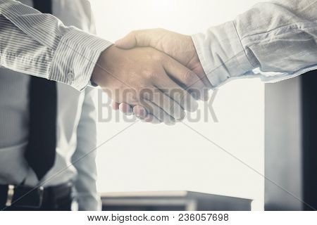 Handshake After Good Cooperation, Two Businessman Handshake After Discussing Good Deal Of Trading Co