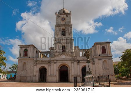 Cathedral In Downtown Holguin, Cuba. Landscape With A Temple In Sunny Weather