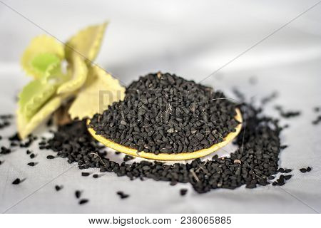 Close Up Of Oil Of Kalonji With Ayurvedic Herb Ajwain Isolated On White Used To Remove Cough And For