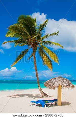 Holguin, Cuba, Playa Esmeralda. Beautiful Caribbean Sea Turquoise Blue Color And Palm Trees On The B
