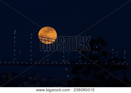 Super Blue Blood Moon Behind Bosphorus Bridge In Istanbul, Turkey