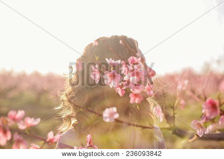 Multi-exposure Flower Girl. Peach Blossom In Spring Garden.