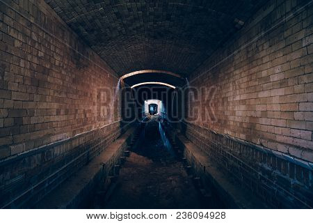 Red Brick Abandoned Underground Sewer Tunnel With Dramatic Mysterious Atmosphere, Inside Sewerage, D