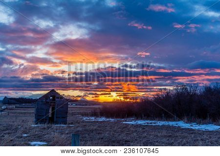 Stunning Sunrise Over A Rustic Out Building, Springbank, Alberta, Canada