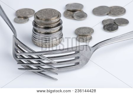 Conceptual Representation Of Financial Greed By Two Forks And Coins