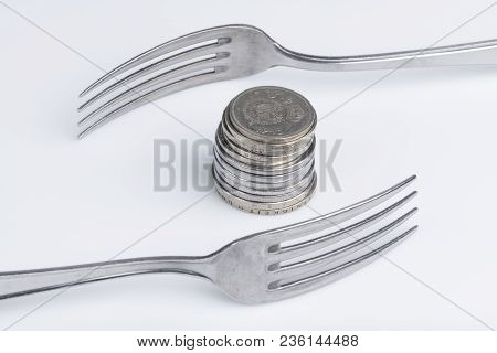 Conceptual Representation Of Financial Greed By Two Forks And Coins