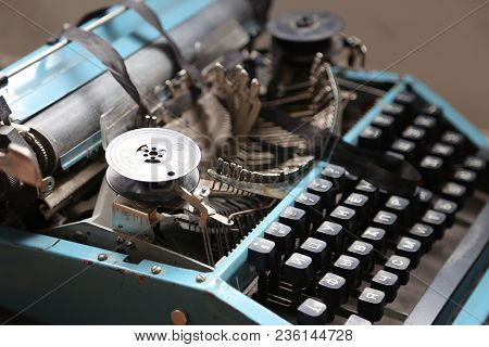 The Old Typewriter In Beams Of The Sun. In Natural Lighting, In Light From A Window. Retro Style. Ol