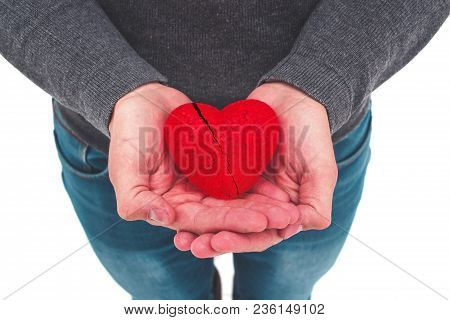 Man Is Holding A Broken Heart In His Hands. Cardiovascular Disease. Unrequited Love. Helping Hand.