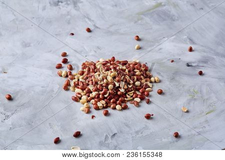Mix Of Raw Shelled Peanuts In Wooden Plate Isolated Over White Textured Background, Top View, Close-