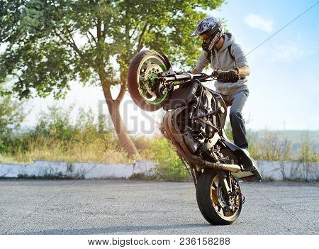 Ivano-frankivsk, Ukraine - 28 August 2015 : Young Biker Wearing Colorful Protective Helmet Is Maikin