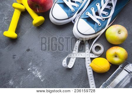 Healthy Breakfast, Sport, Fitness, Diet Concept. A Bottle Of Water, Apples, Dumbbells, R Unning Shoe