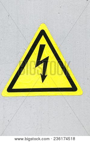 High Voltage Danger Yellow Sign On A Brick Wall Building