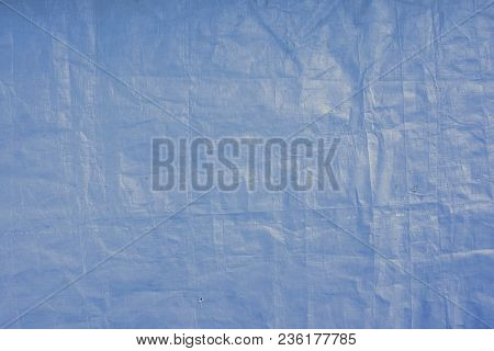 Blue Plastic Tarp Texture Background. Blue Colored Plastic.