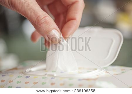 Hand Picked A Wet Wipes In Package Box, Wet Wipes In A Woman's Hand