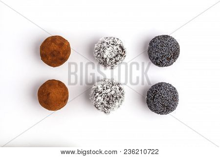 Homemade Healthy Raw Energy Balls With Carob, A Poppy And Coconut Isolated On White Background, Top 
