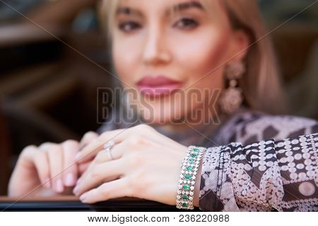 Beautiful Woman With Yellow Sport Car. Young Female Model With Lixury Diamonds Jewerly Sitting In A 