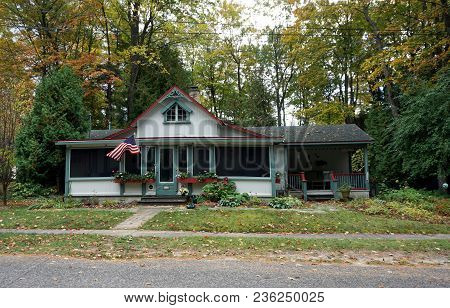 Bay View, Michigan / United States - October 16, 2017:  A Cottage In Bay View Flies The American Fla