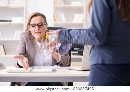 Angry boss dismissing employee for bad underperformance