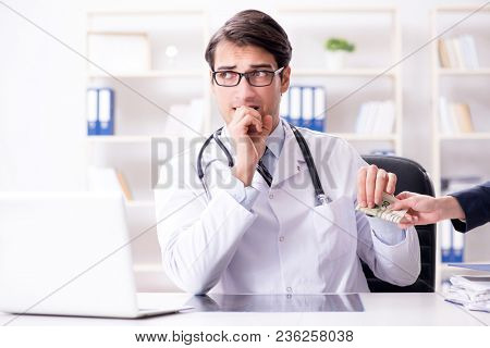 Doctor in corruption concept with being offered bribe