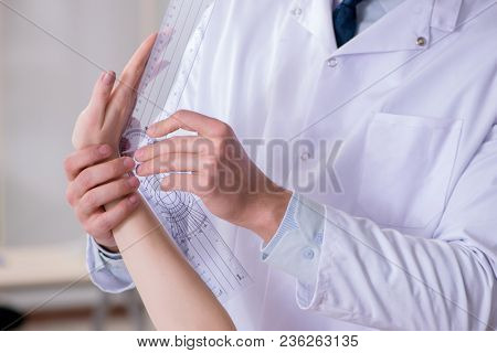 Doctor checking patients joint flexibility