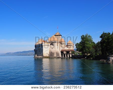 View Of Medieval Chateau De Chillon Castle At Lake Geneva In Montreux City, Canton Of Vaud In Switze