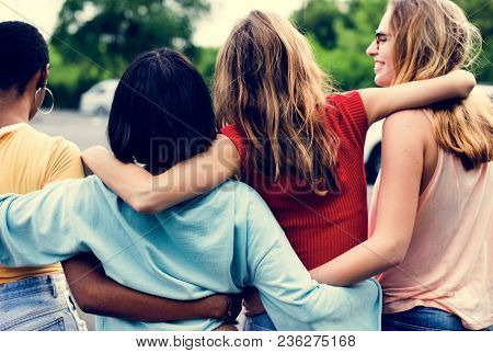 Rear view of a group of diverse woman friends walking together