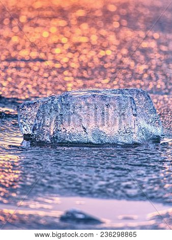Ice Shard And Small Cracked Ice Pieces On Melring Glacier. Icy Fragments Are Melting On Flow Ice And