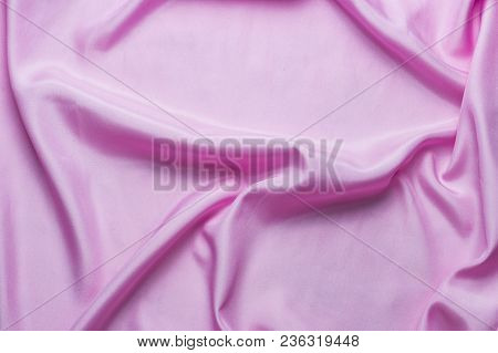 Smooth Silk Fabric Or Statin Of Pink With Waves, Can Be Used As Background Or Wallpaper