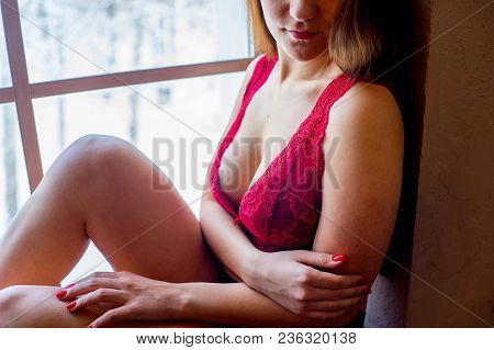 A Portrait Of A Beauriful Woman In A Lingerie