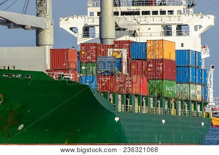 Labuan,malaysia-april 6,2018:cargo Ship,full Of Shipping Containers In The Port Of Labuan,malaysia.i