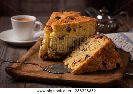 Cup Of Coffee And Slices Of Home Made Cake With Raisins On Wooden Plate,vintage Style