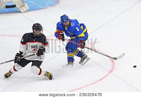 Kyiv, Ukraine - April 14, 2018: Shota Kaneko Of Japan (l) Fights For A Puck With Serhi Lohach Of Ukr