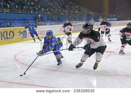Kyiv, Ukraine - April 14, 2018: Dmytro Danylenko Of Ukraine (l) Fights For A Puck With Taiki Takebe 