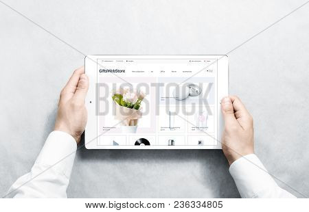 Hands Holding Tablet With Gifts Webstore Mock Up On Screen, Isolated. Clothing Web Page Interface Mo