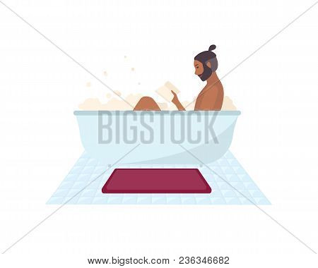 African American Man Sitting In Bathtub Full Of Soap Foam And Reading Book Isolated On White Backgro