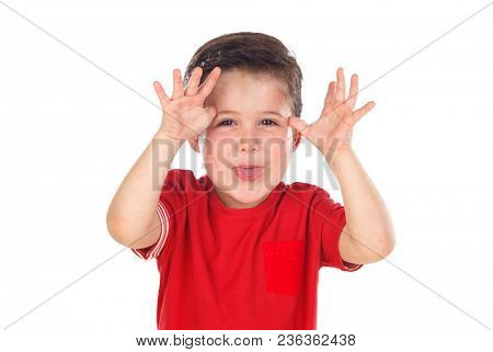 Funny boy with red shirt making fun looking at camera isolated on a white background