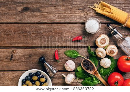 Italian Food Ingredients For The Preparation Pasta On Wooden Background. Top View. Copy Space. Still