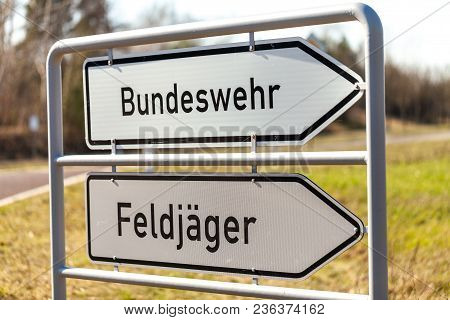 German Bundeswehr And Feldjaeger Sign Near A Barrack. Bundeswehr Means German Armed Forces And Feldj