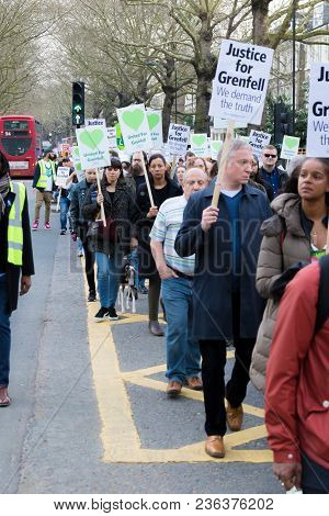 London, United Kingdom, 14th April 2018:- Marchers On A Silent March From Kensington Town Hall To Th