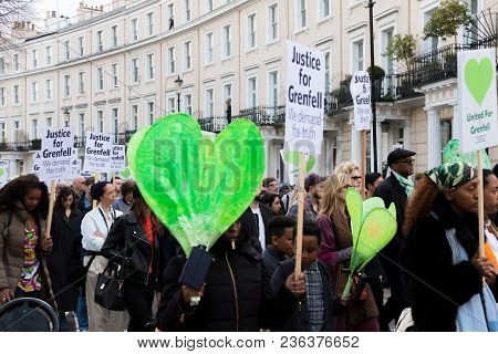 London, United Kingdom, 14th April 2018:- Marchers On A Silent March From Kensington Town Hall To Th