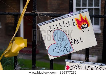 London, United Kingdom, 14th April 2018:- Banners Near The Ruins Of Grenfell Tower Ten Months On Fro