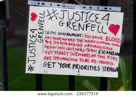 London, United Kingdom, 14th April 2018:- Banners Near The Ruins Of Grenfell Tower Ten Months On Fro