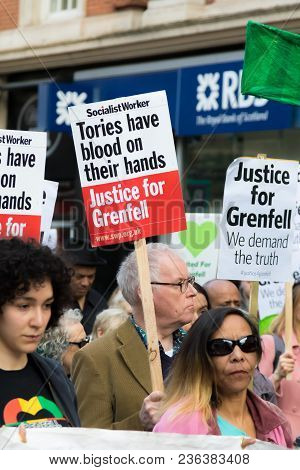 London, United Kingdom, 14th April 2018:- Marchers On A Silent March From Kensington Town Hall To Th
